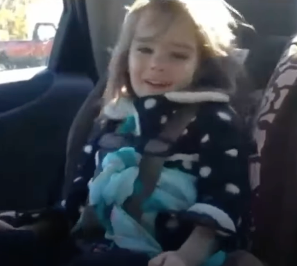 Taylor Swift fan listening to Shake it Off in car seat. 